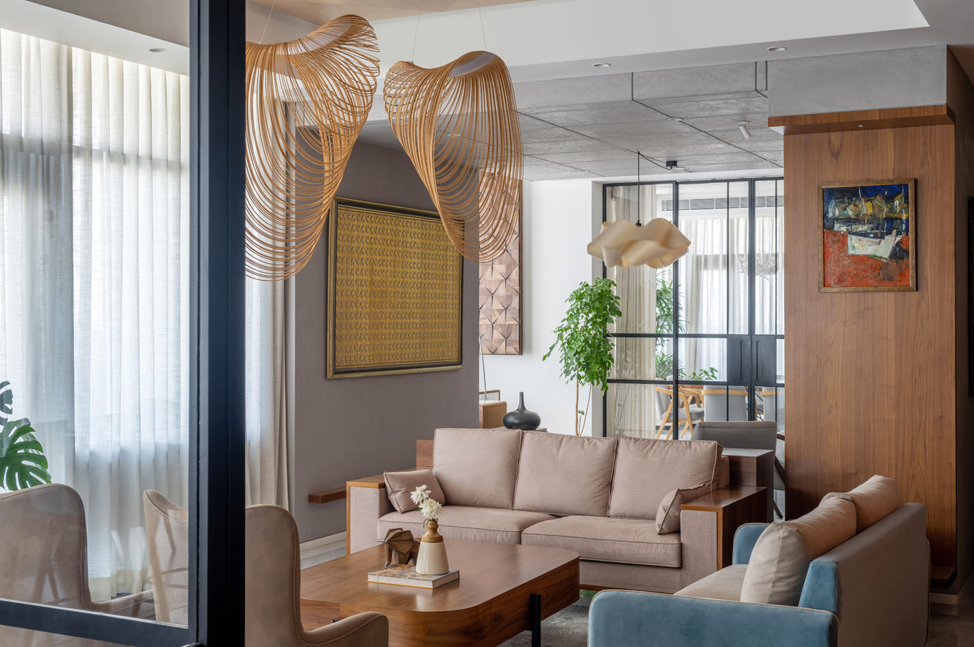 Contemporary Contours living room in a 5,000 sq ft luxury apartment, featuring a neutral color palette, wooden accents, and unique lighting fixtures. Panoramic city views through large windows.